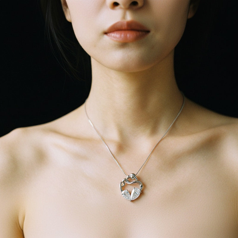 Model wearing heart pendant