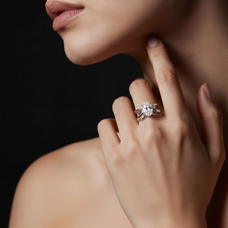 Model wearing oval criss cross fancy solitaire ring