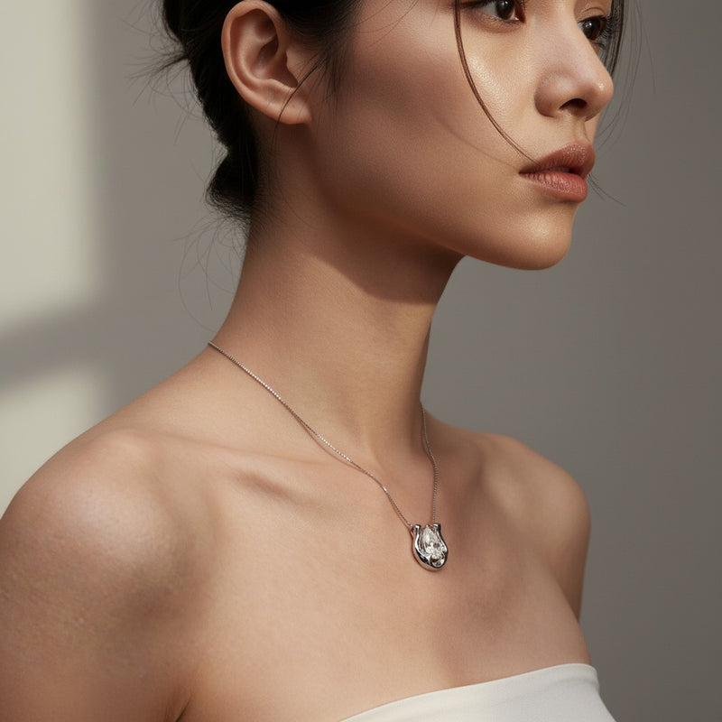 Model wearing pear necklace