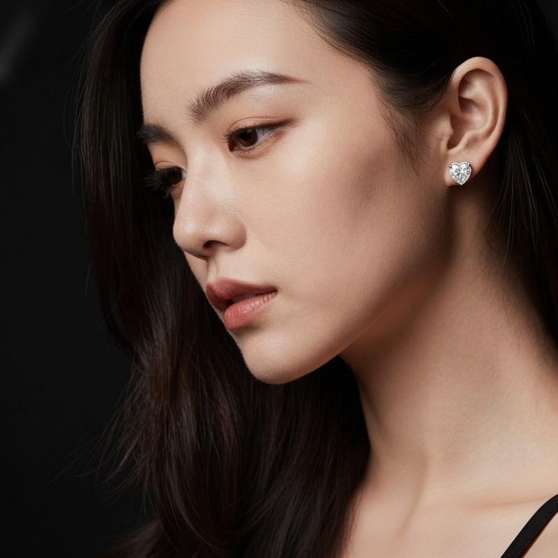 Model wearing heart earrings
