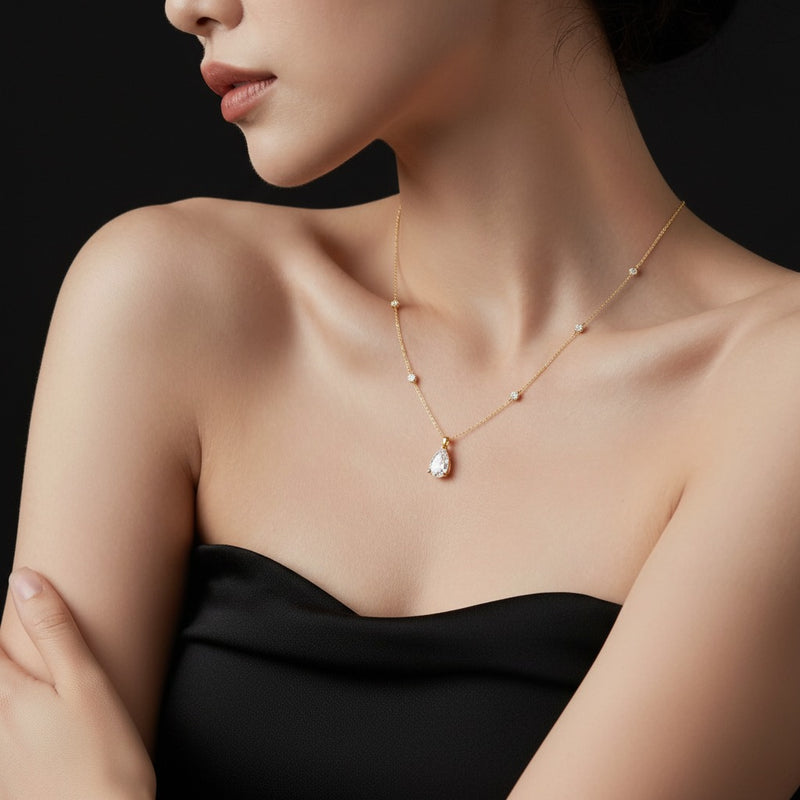 Model wearing pear strata chic collection necklace