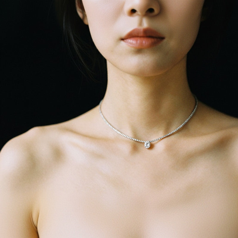 Model wearing pear strata chic collection necklace