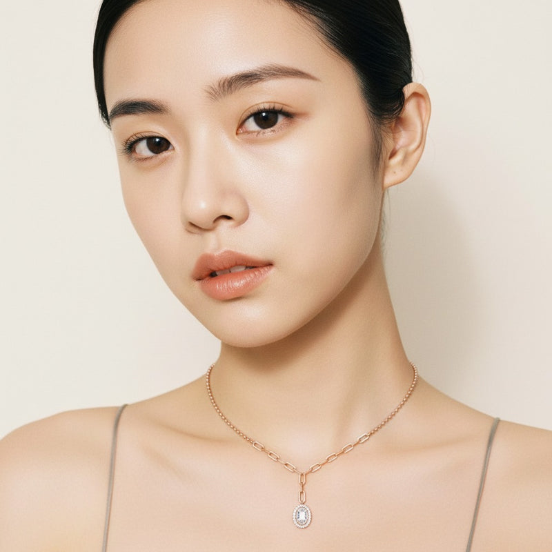 Model wearing oval solitaire necklace