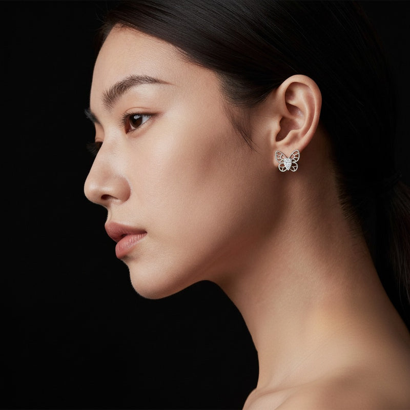 Model wearing pear butterly fashion earrings