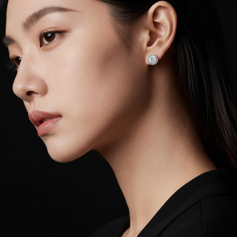 Model wearing round stud earrings
