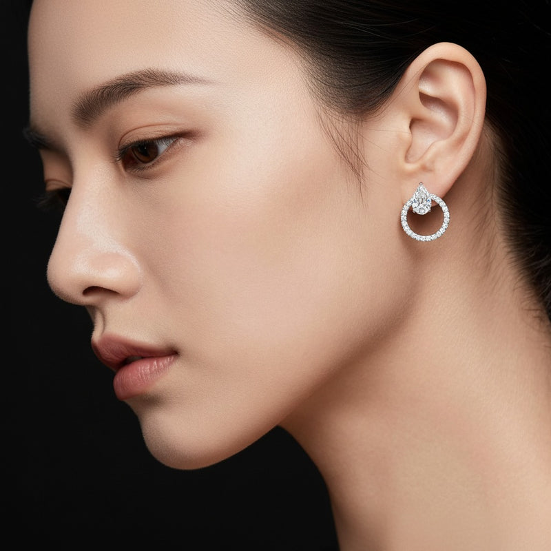 Model wearing pear dangle fashion earrings