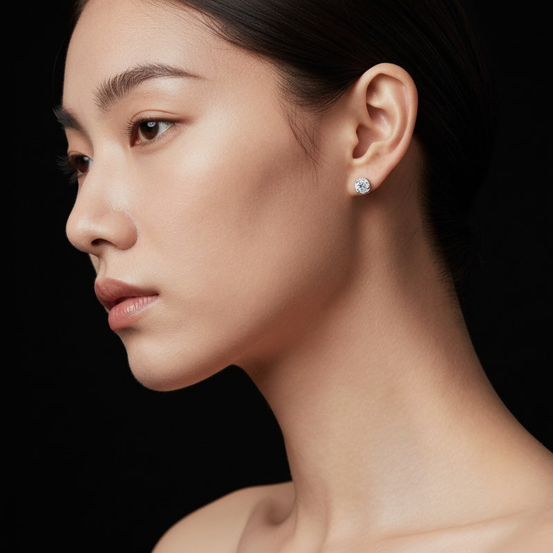 Model wearing round stud earrings