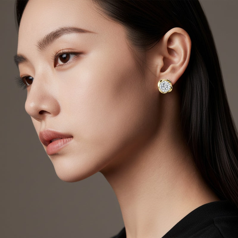 Model wearing round stud earrings