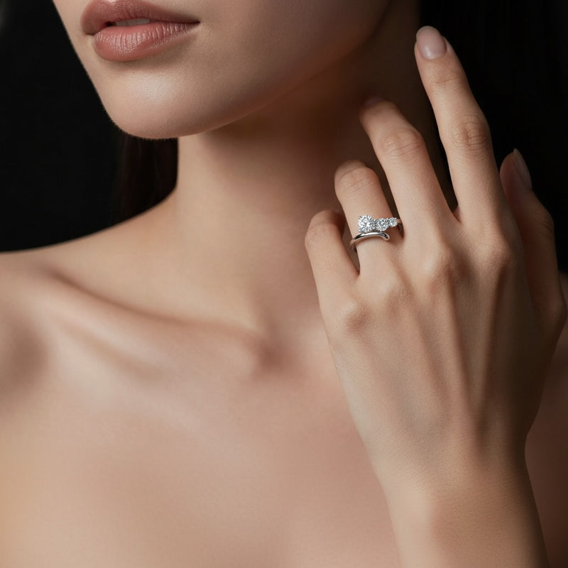 Model wearing round three stone ring