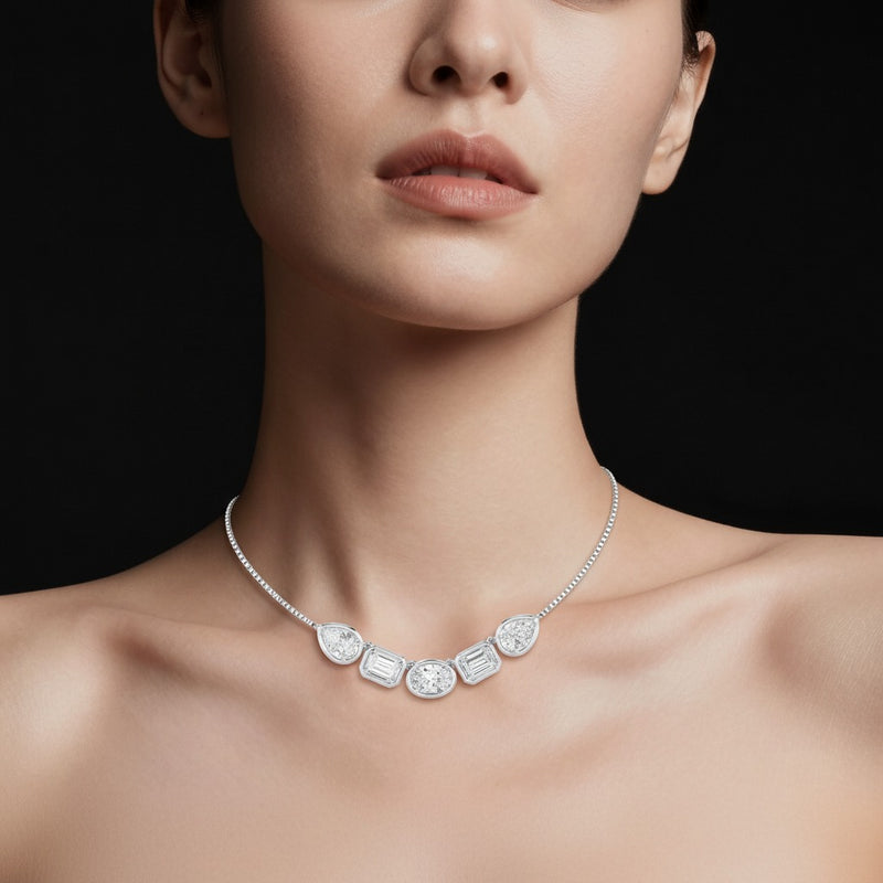 Model wearing oval five stone necklace