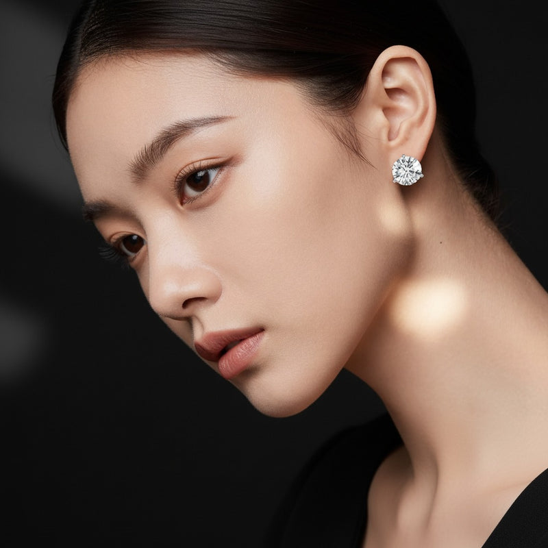 Model wearing round three prong martini stud earrings