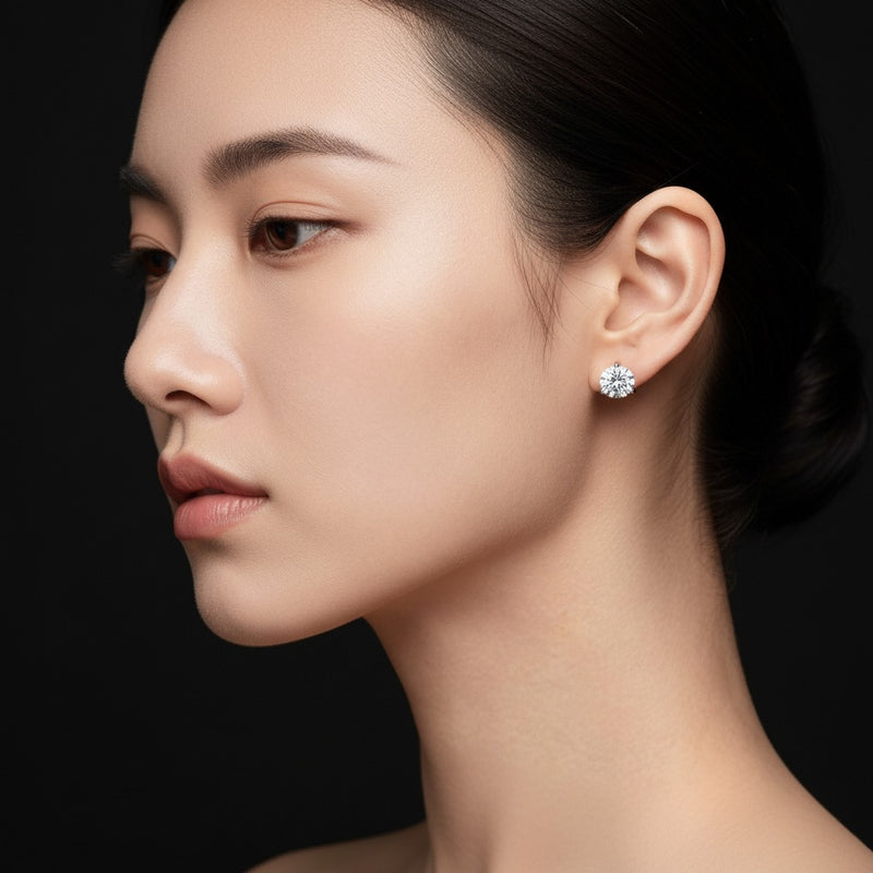 Model wearing round three prong martini stud earrings
