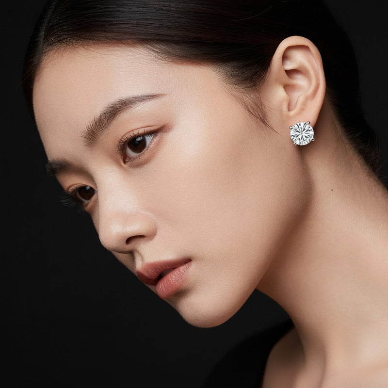 Model wearing round three prong martini stud earrings