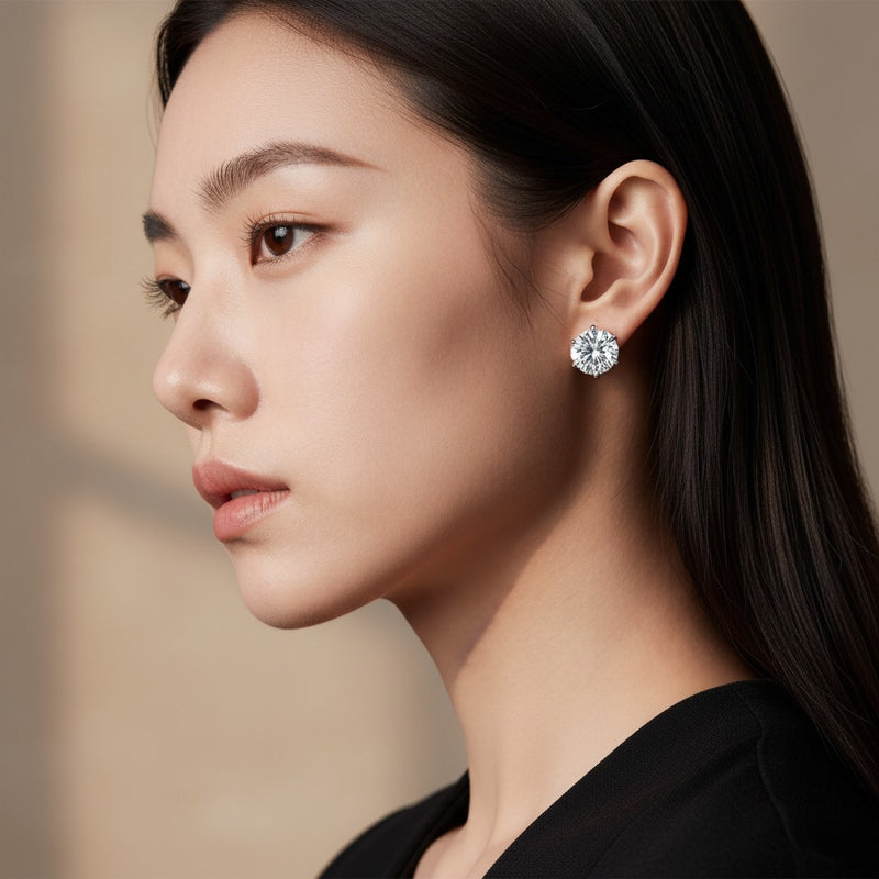 Model wearing round three prong martini stud earrings
