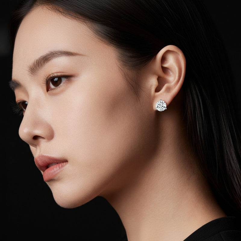 Model wearing round three prong martini stud earrings