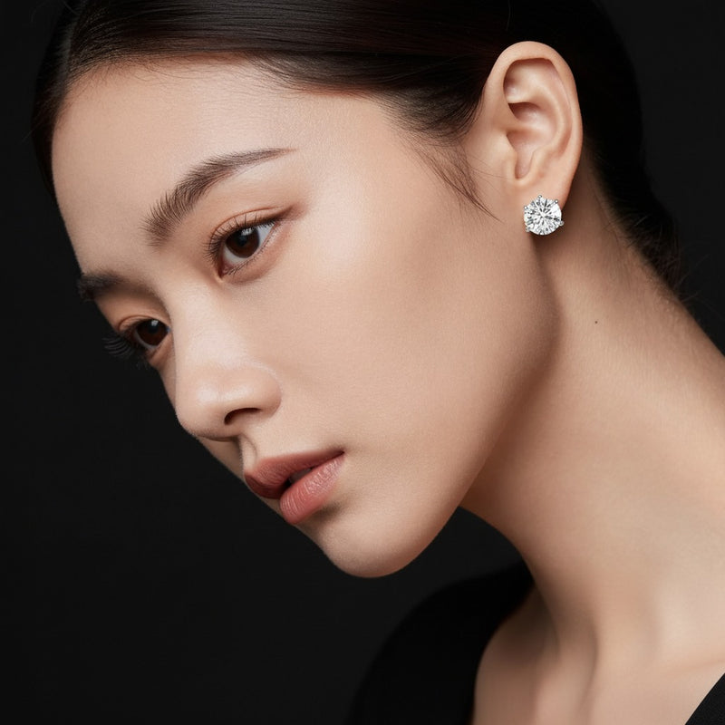 Model wearing round three prong martini stud earrings