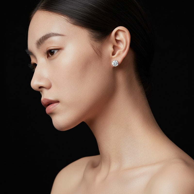 Model wearing round three prong martini stud earrings
