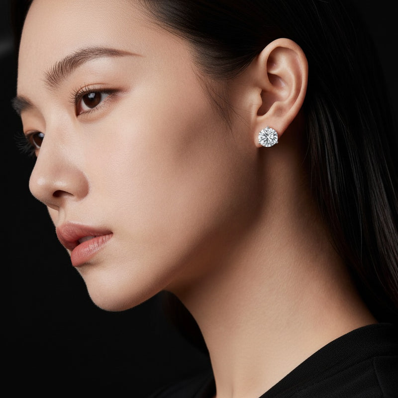 Model wearing round three prong martini stud earrings