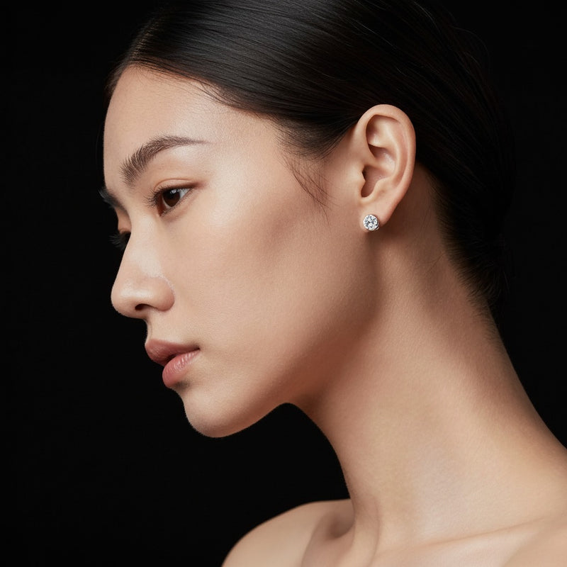 Model wearing round three prong martini stud earrings