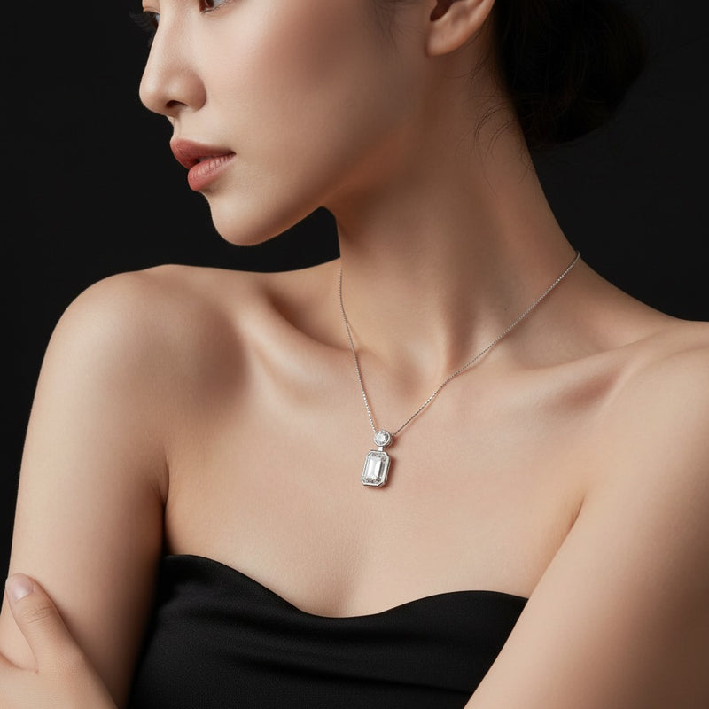 Model wearing emerald toi et moi fashiion pendant