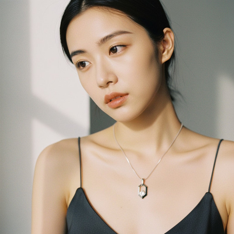 Model wearing round fancy pendant