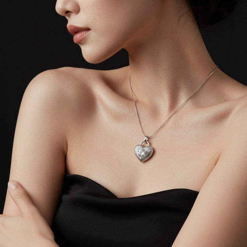 Model wearing heart pendant