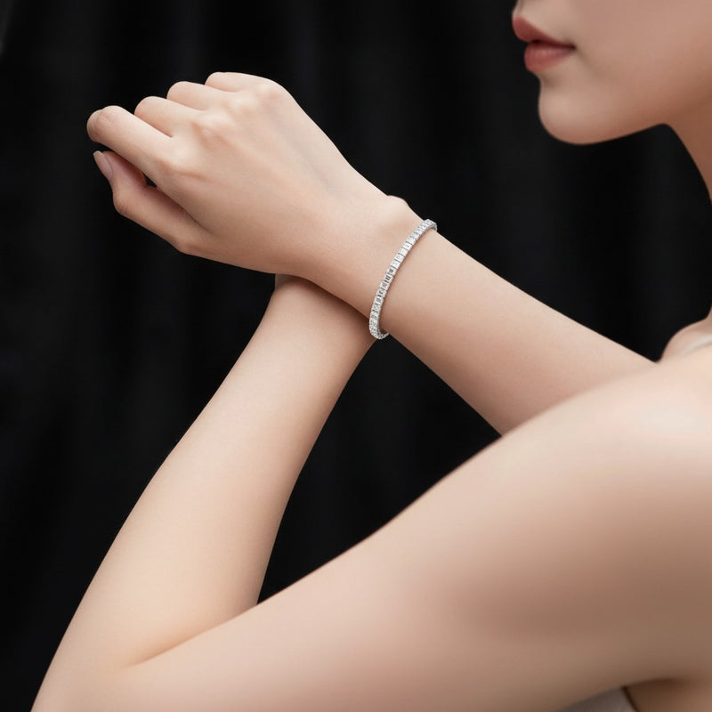 Model wearing emerald lab grown diamond north south bracelet