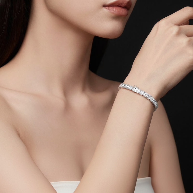 Model wearing emerald east west bezel set bracelet