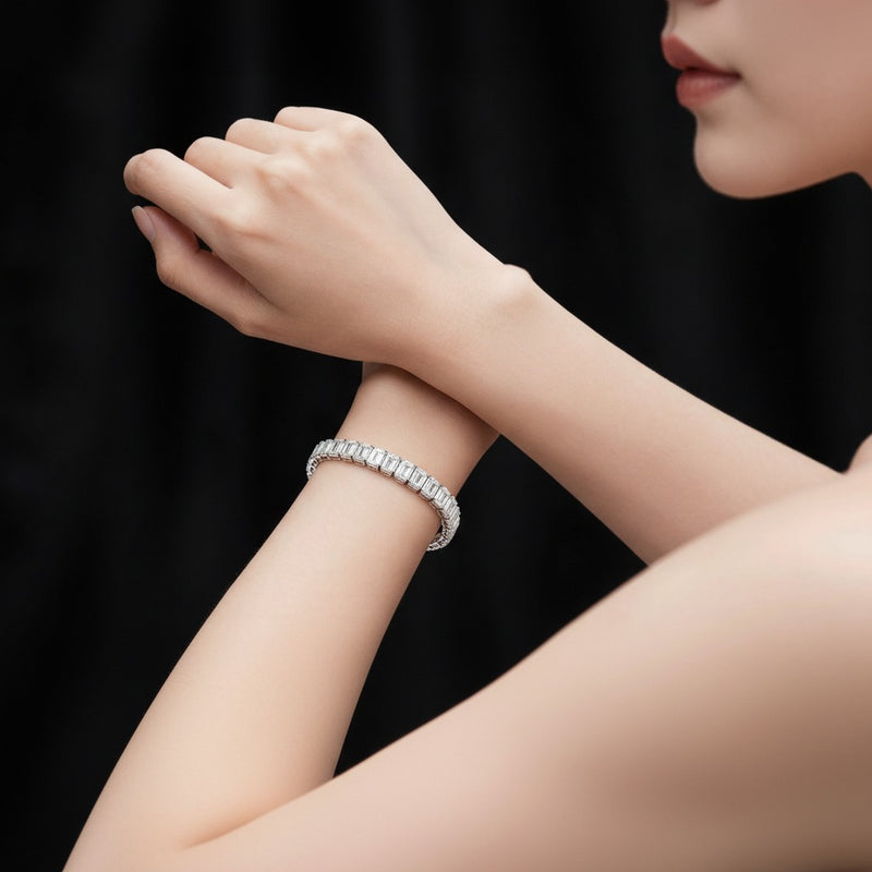 Model wearing emerald east west bezel set bracelet