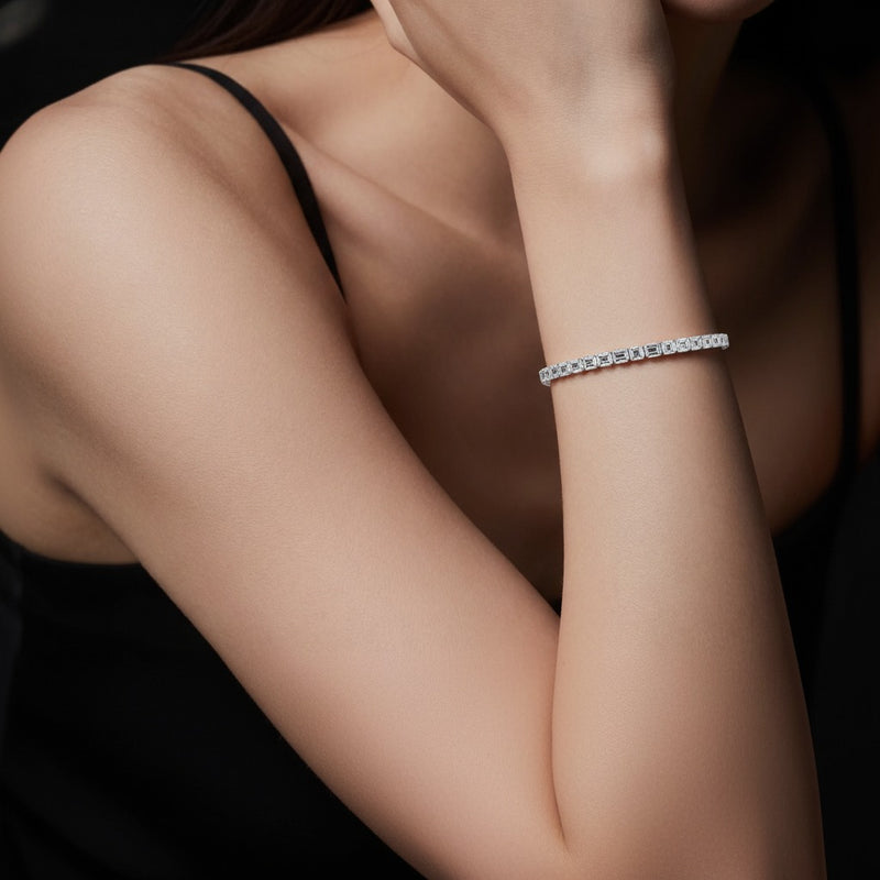 Model wearing emerald east west bezel set bracelet