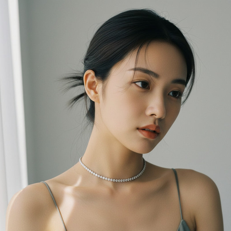 Model wearing oval east west bezel set necklace