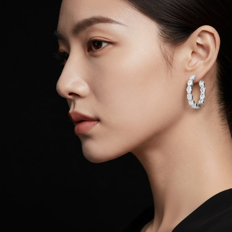 Model wearing oval lab grown diamond inside out hoop earrings