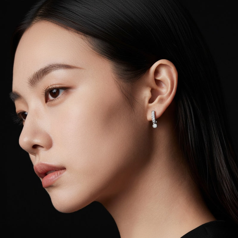 Model wearing round lab grown diamond inside out hoop earrings