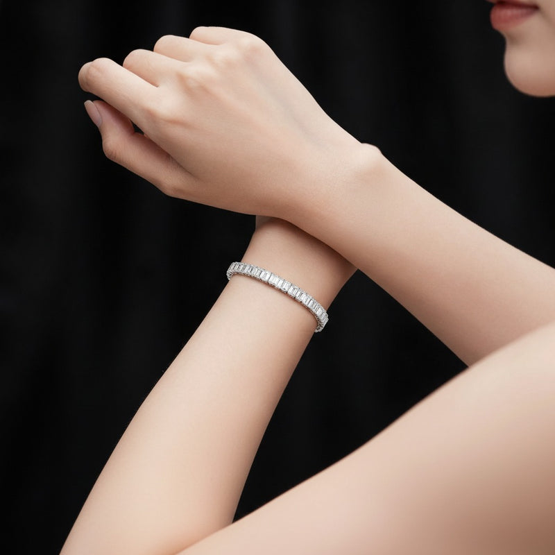 Model wearing emerald lab grown diamond east west bracelet