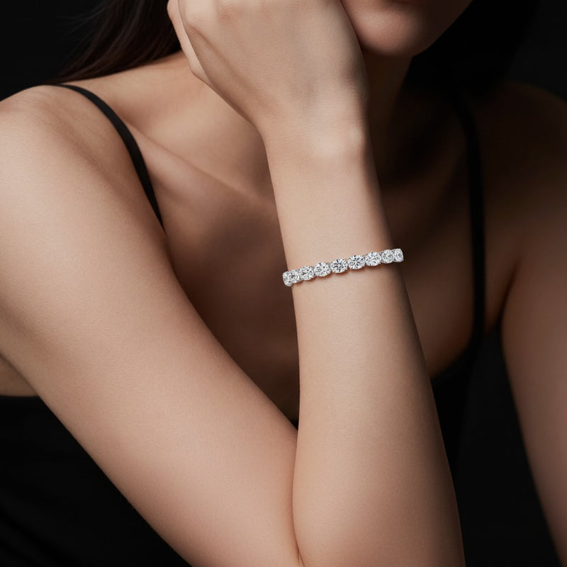 Model wearing oval lab grown diamond east west bracelet