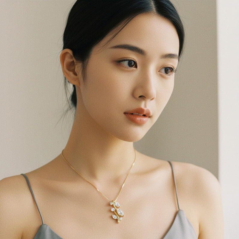 Model wearing marquise leaf motif fashion pendant