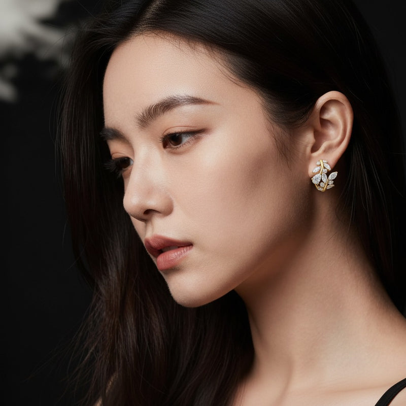 Model wearing pear leaf motif fashion earrings