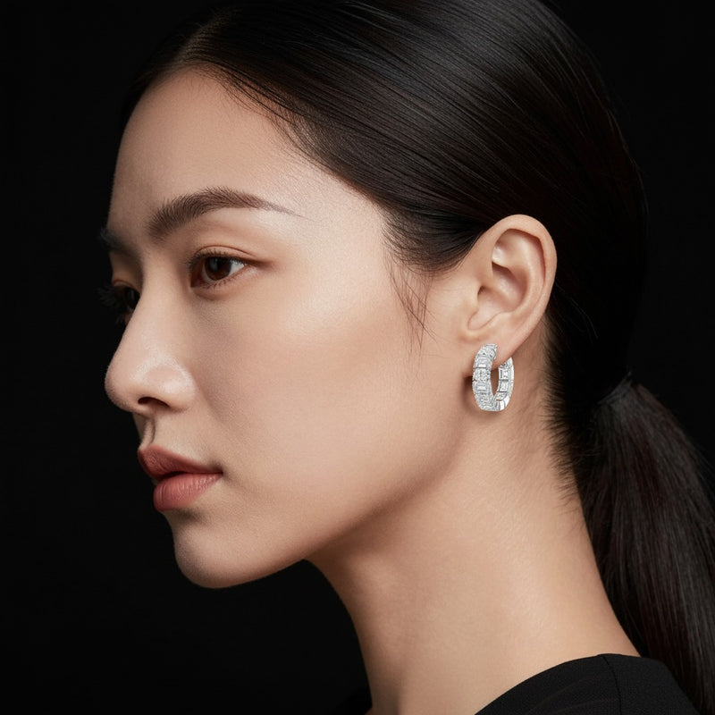 Model wearing emerald inside out hoop earrings