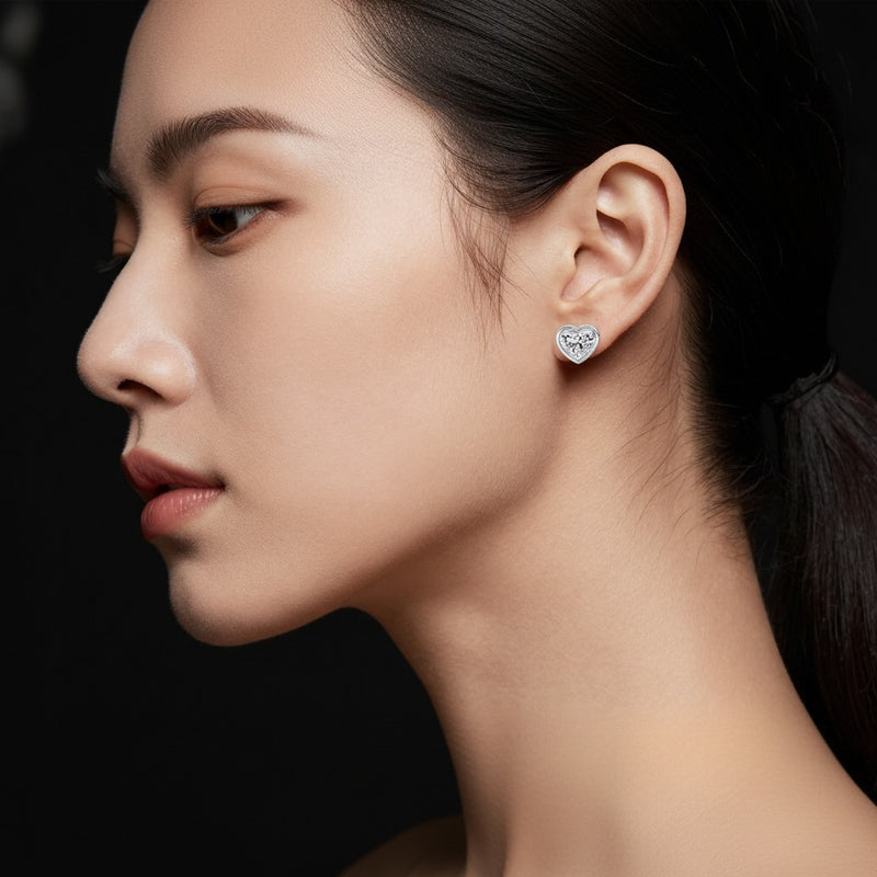 Model wearing heart stud earrings