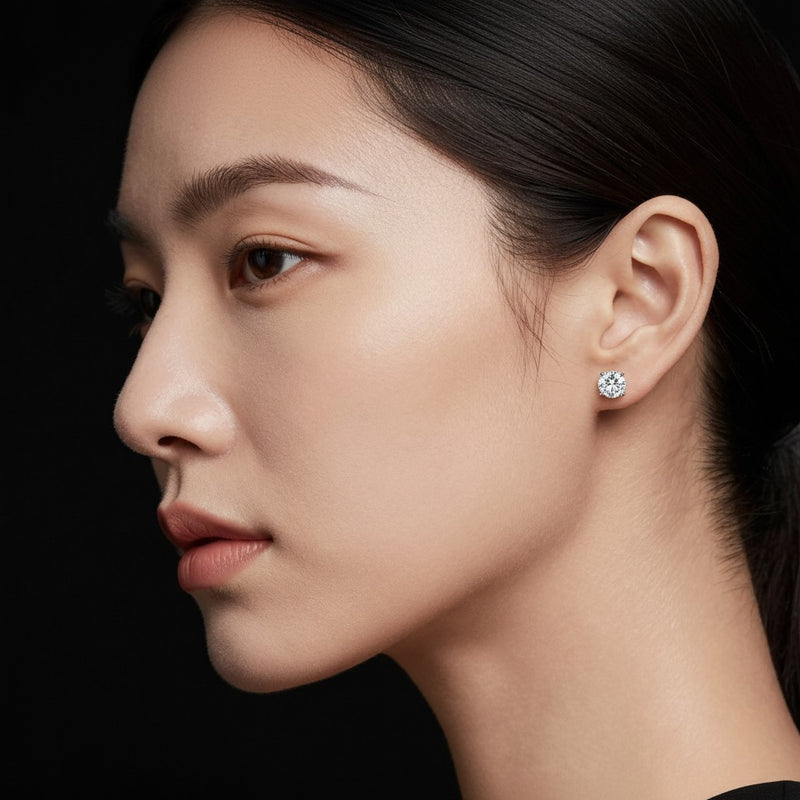 Model wearing round stud earrings