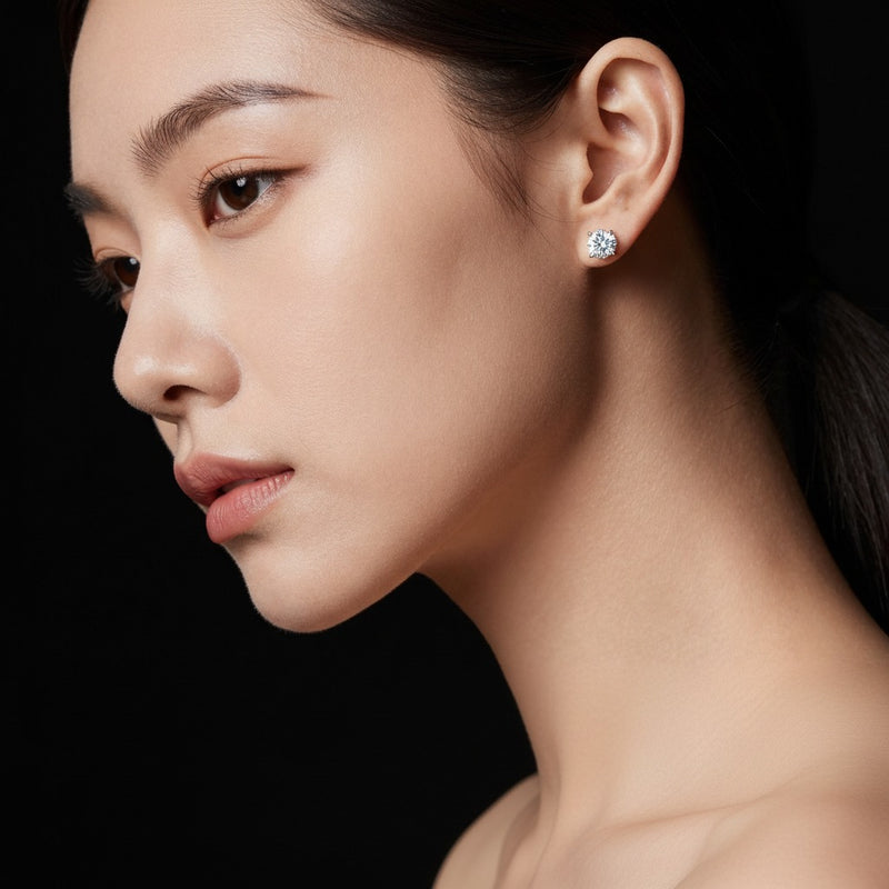 Model wearing round stud earrings