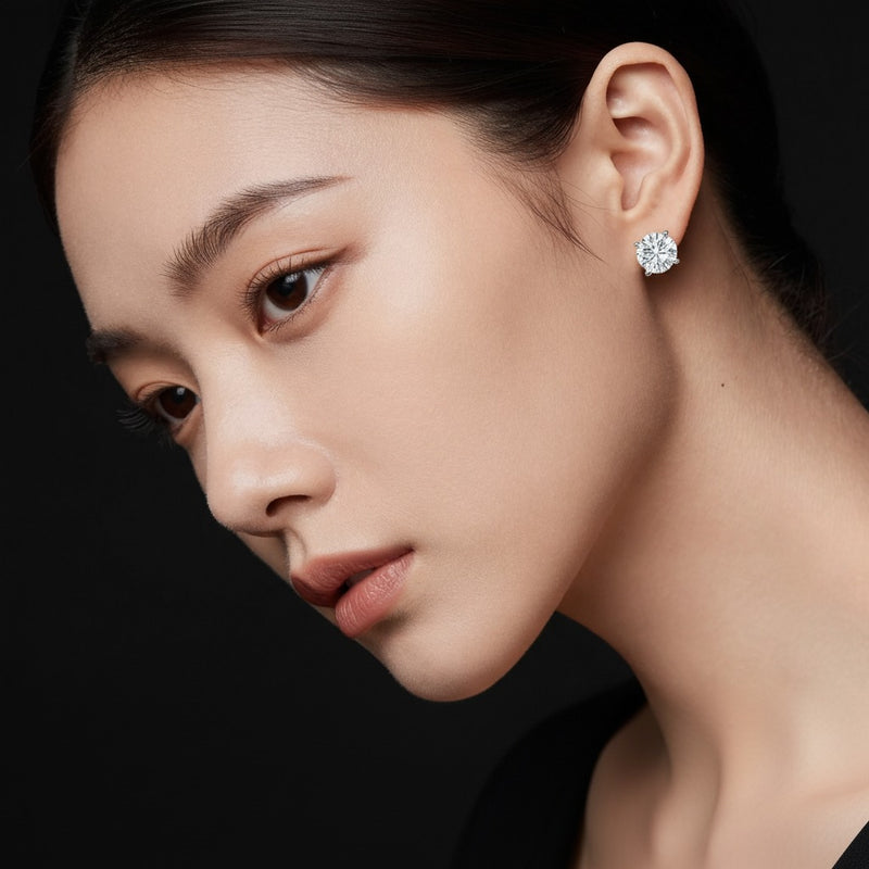 Model wearing round stud earrings