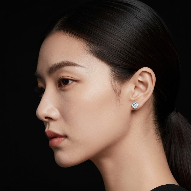 Model wearing round stud earrings