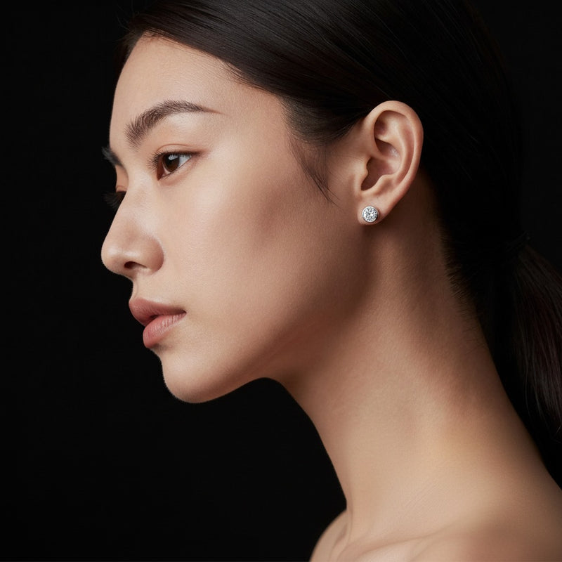Model wearing round stud earrings