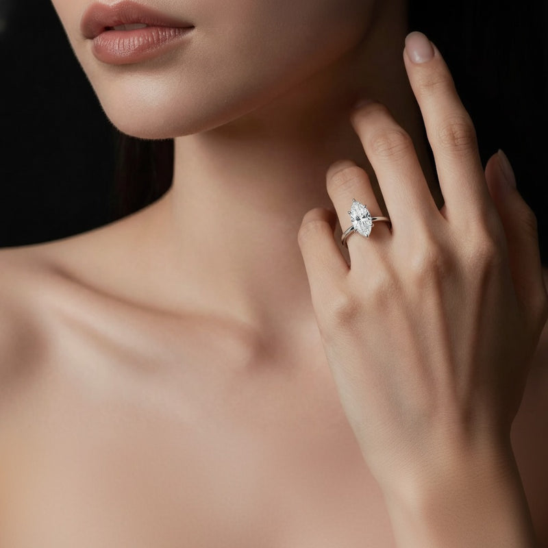 Model wearing marquise lab grown diamond classic solitaire ring