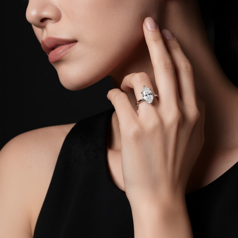 Model wearing marquise lab grown diamond classic solitaire ring