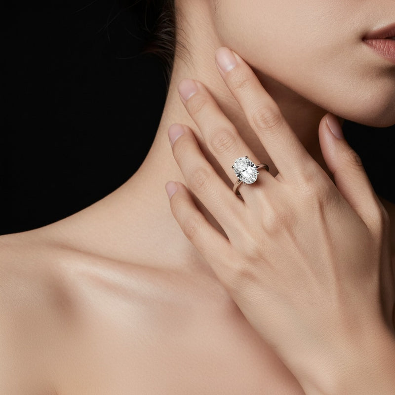 Model wearing oval lab grown diamond classic solitaire ring