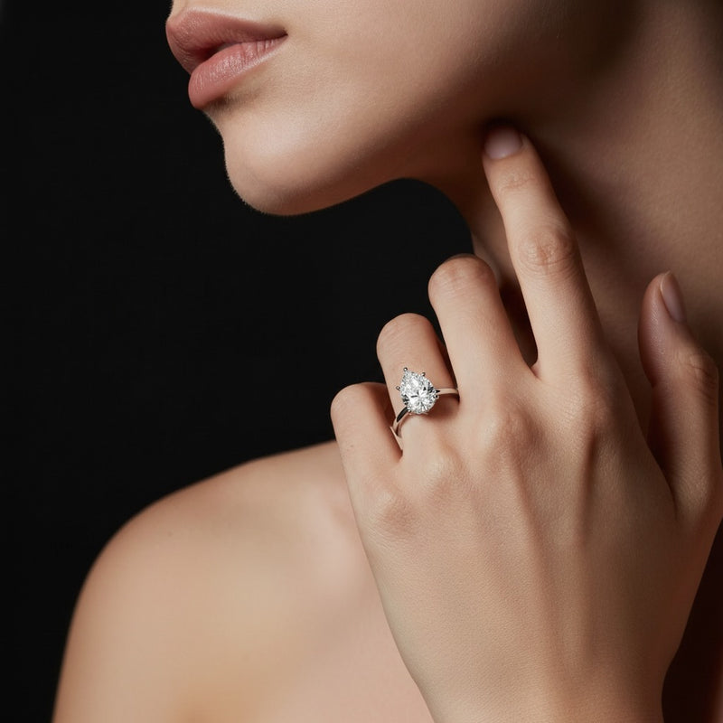 Model wearing pear lab grown diamond classic solitaire ring