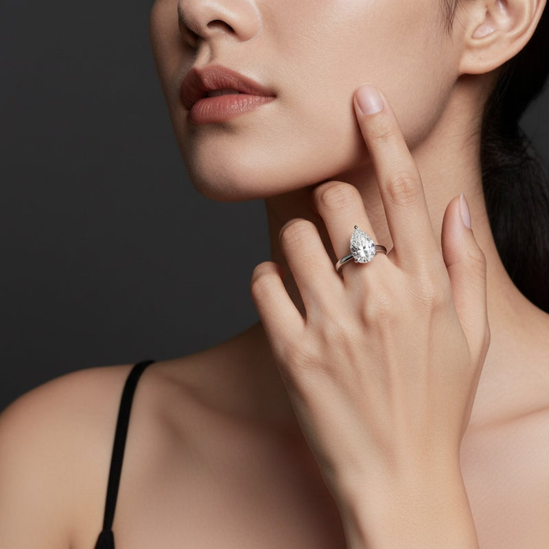 Model wearing pear lab grown diamond classic solitaire ring