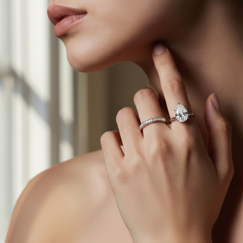 Model wearing pear lab grown diamond classic solitaire ring
